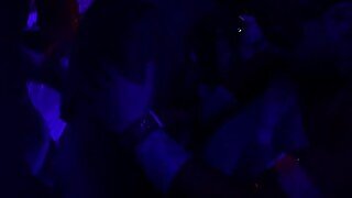 A gorgeous girl gets fingered during a nightclub orgy